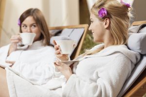 Two young women and tea time at spa resort